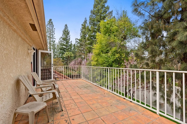 view of patio featuring a balcony