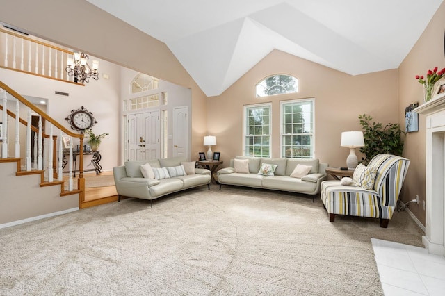 carpeted living area featuring stairway, baseboards, high vaulted ceiling, tile patterned flooring, and a notable chandelier