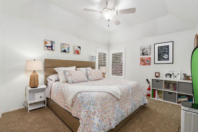 carpeted bedroom with lofted ceiling, a ceiling fan, and baseboards