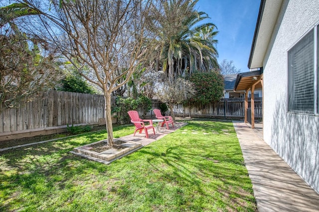 view of yard with a patio and a fenced backyard