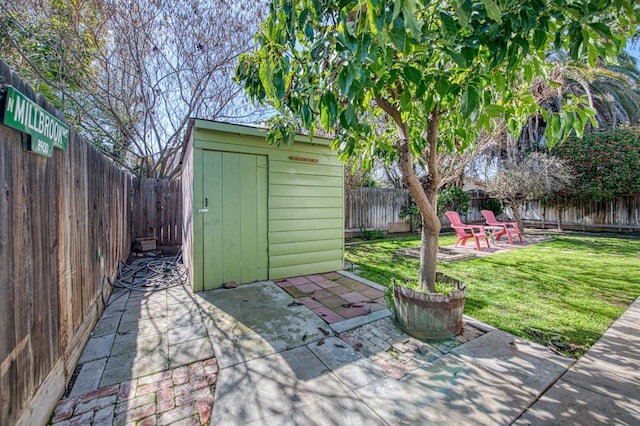 view of patio / terrace featuring a storage shed, a fenced backyard, and an outdoor structure