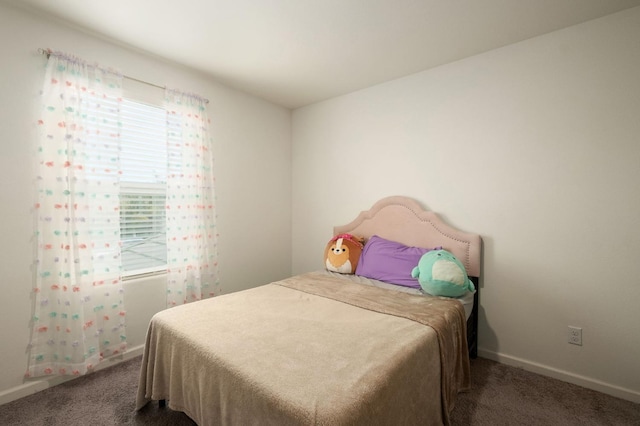 carpeted bedroom with baseboards