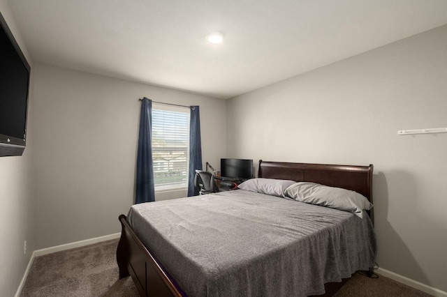 carpeted bedroom with baseboards