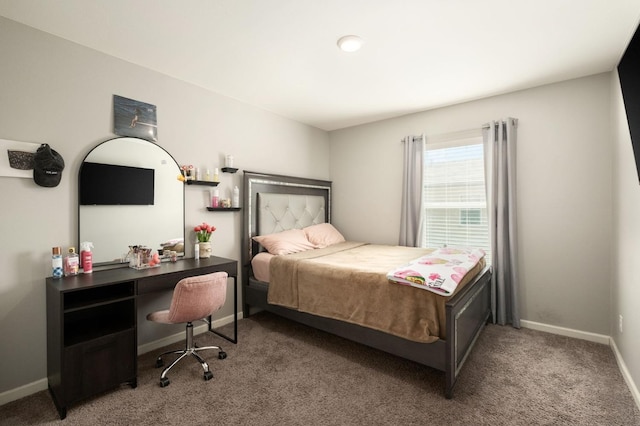 bedroom featuring carpet flooring and baseboards