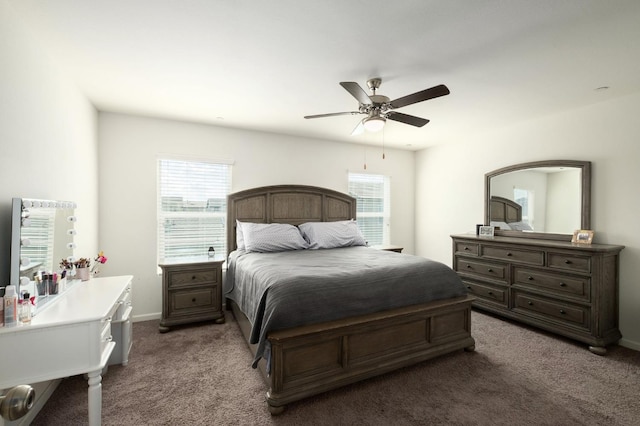 bedroom featuring dark carpet, baseboards, and ceiling fan