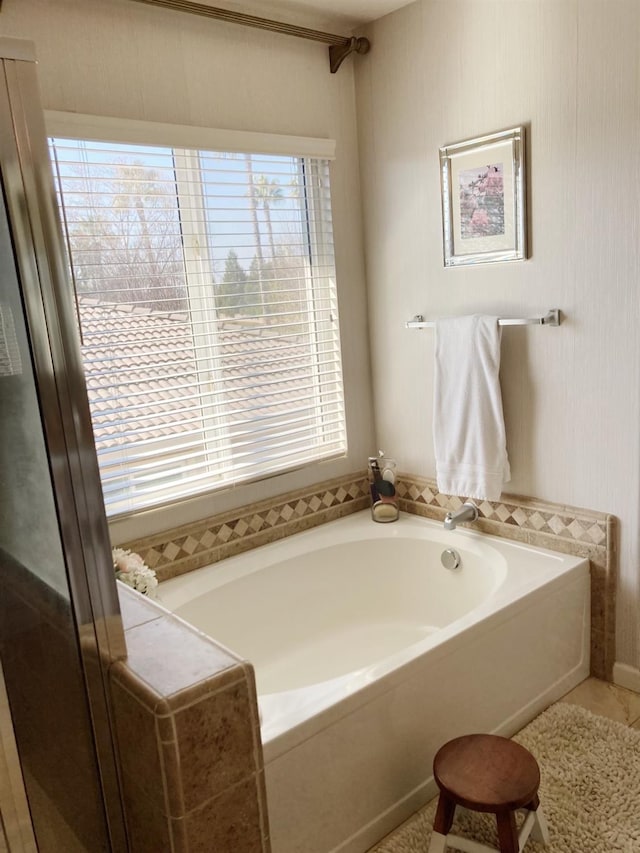 full bathroom featuring a garden tub