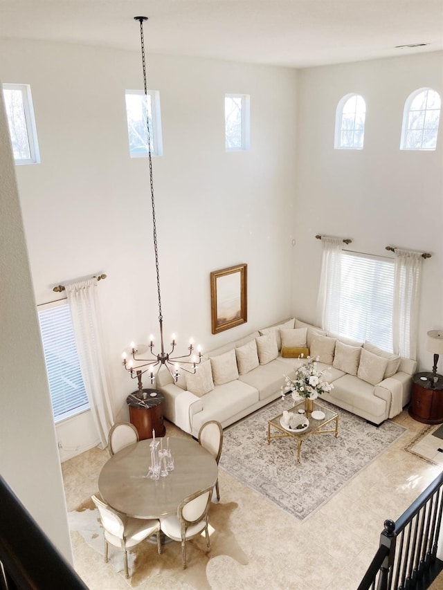 living area featuring a towering ceiling