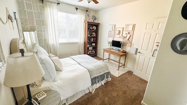 carpeted bedroom featuring baseboards and ceiling fan