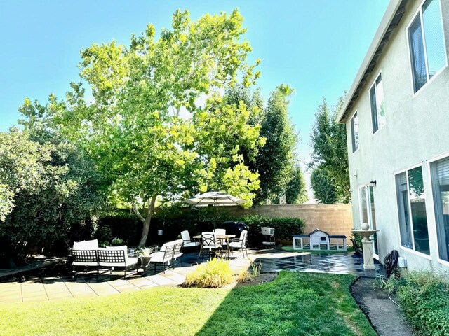 view of yard featuring a patio area and fence