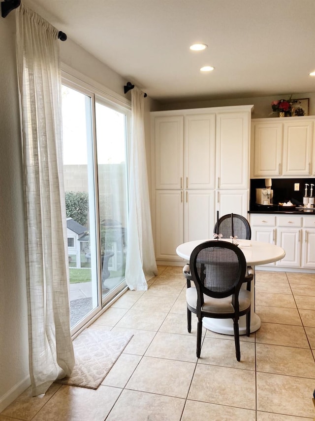 dining room featuring light tile patterned flooring and recessed lighting