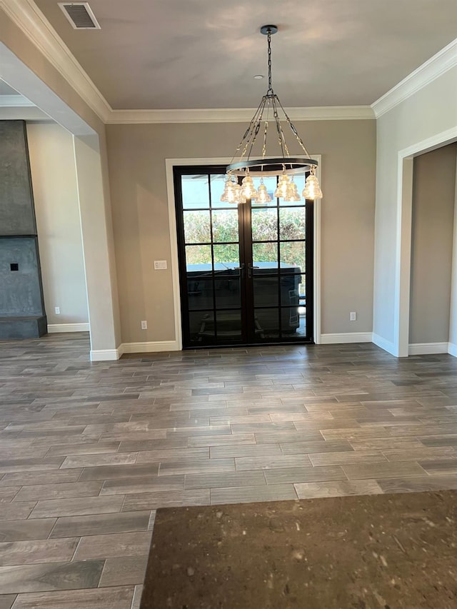 entrance foyer featuring visible vents, crown molding, baseboards, and wood tiled floor