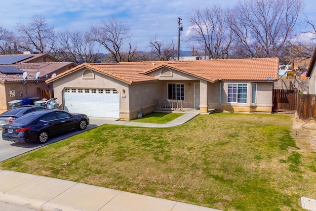 single story home with a front yard, fence, driveway, stucco siding, and a tiled roof