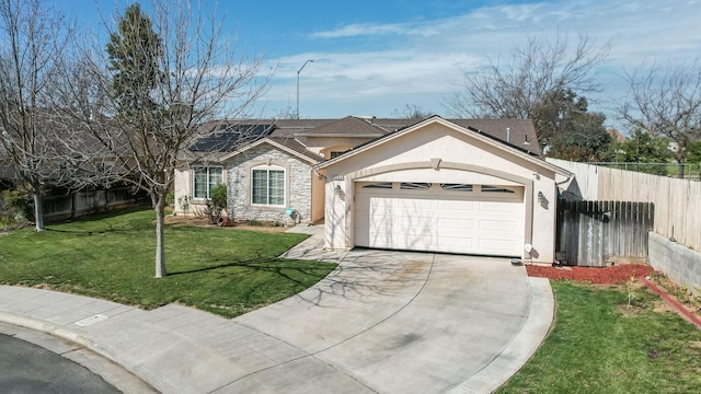 ranch-style home featuring solar panels, an attached garage, stucco siding, a front lawn, and stone siding