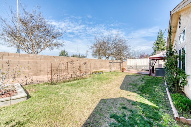 view of yard featuring a gazebo, central air condition unit, and a fenced backyard