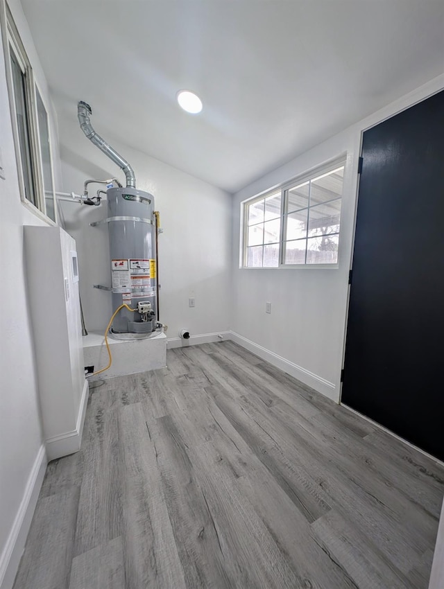 utility room featuring water heater