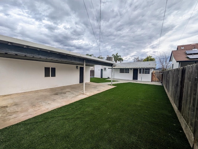 view of yard featuring a patio area and a fenced backyard