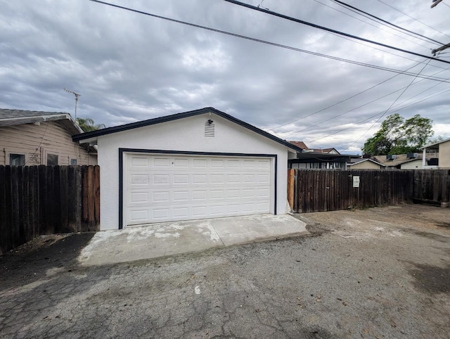 detached garage with fence