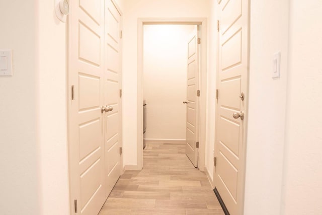 hallway featuring light wood-style floors