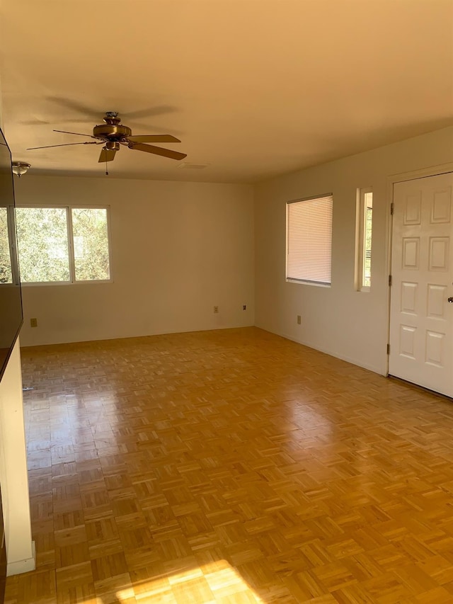 spare room with ceiling fan