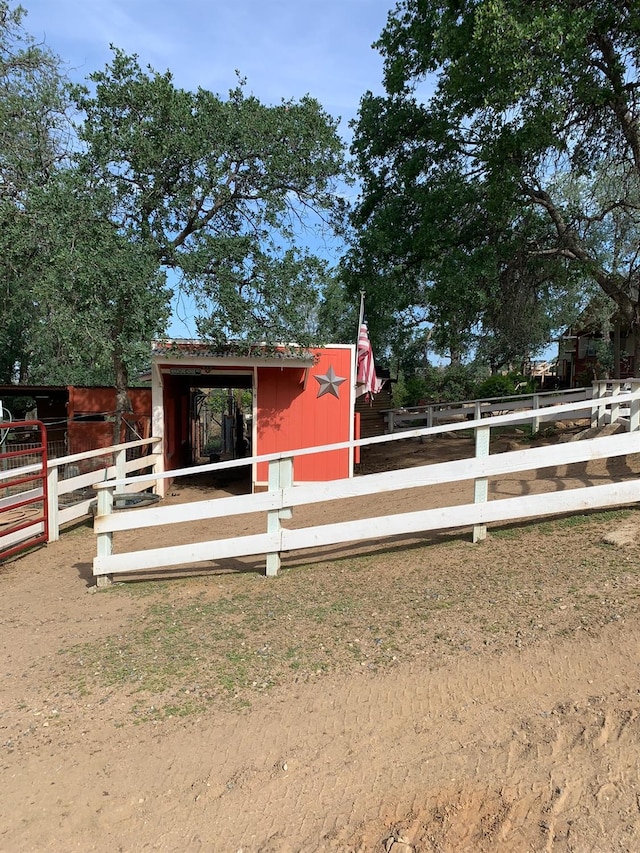 view of front of house featuring an exterior structure and an outdoor structure