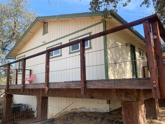 view of side of property with central air condition unit