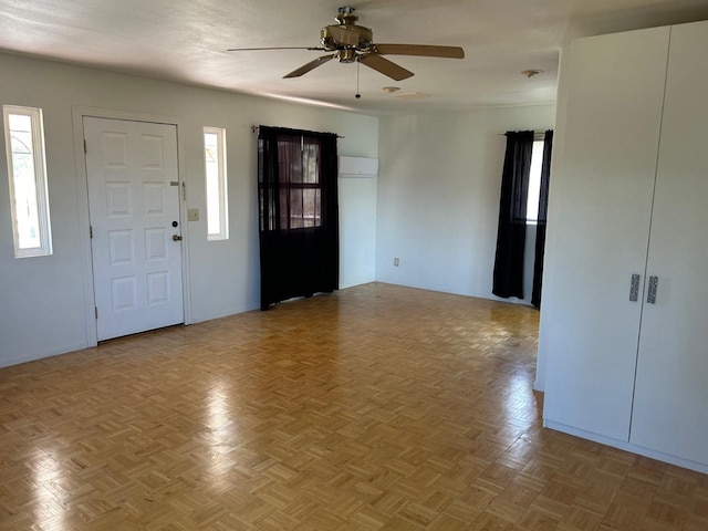 foyer entrance with ceiling fan