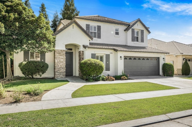 view of front of house featuring stucco siding, a tiled roof, driveway, and a front lawn