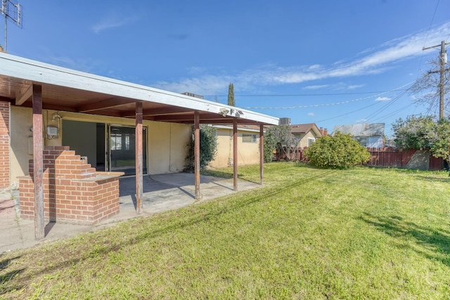 view of yard with a patio area and fence