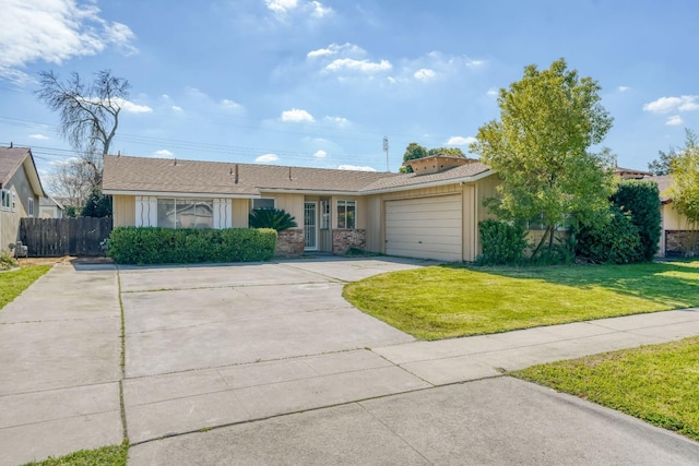 ranch-style house with a garage, driveway, a front yard, and fence