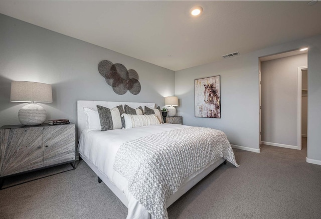 bedroom featuring visible vents, baseboards, and carpet