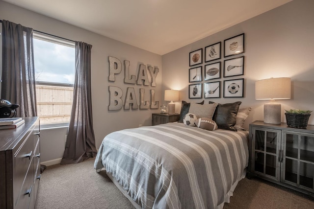 bedroom with carpet and baseboards