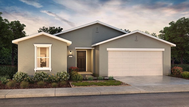 ranch-style house featuring stucco siding, an attached garage, and concrete driveway