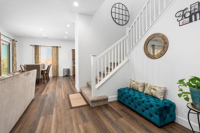 interior space with recessed lighting, wood finished floors, and baseboards