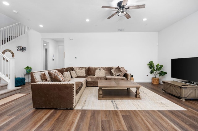 living area with visible vents, ceiling fan, stairs, recessed lighting, and wood finished floors