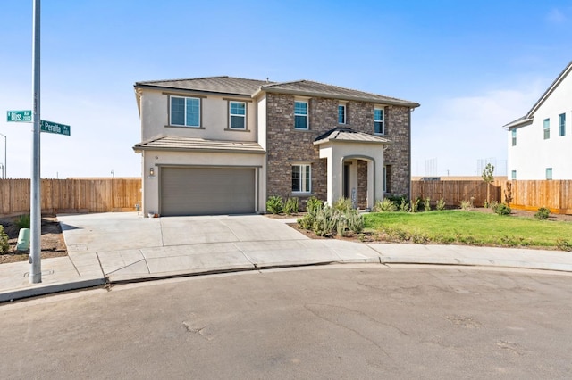 view of front facade featuring stucco siding, a front lawn, fence, concrete driveway, and an attached garage