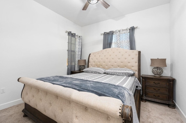 bedroom with a ceiling fan, carpet, and baseboards