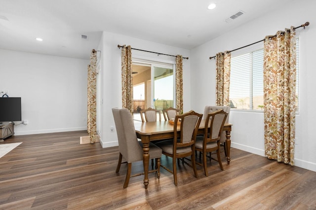 dining space with visible vents, recessed lighting, baseboards, and wood finished floors