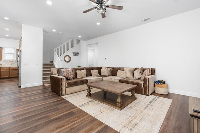 living area with stairs, dark wood-type flooring, recessed lighting, and visible vents