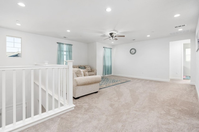 sitting room with visible vents, recessed lighting, baseboards, and carpet