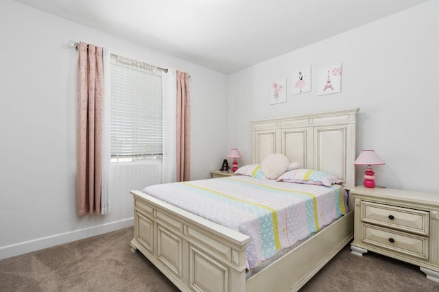 carpeted bedroom with baseboards