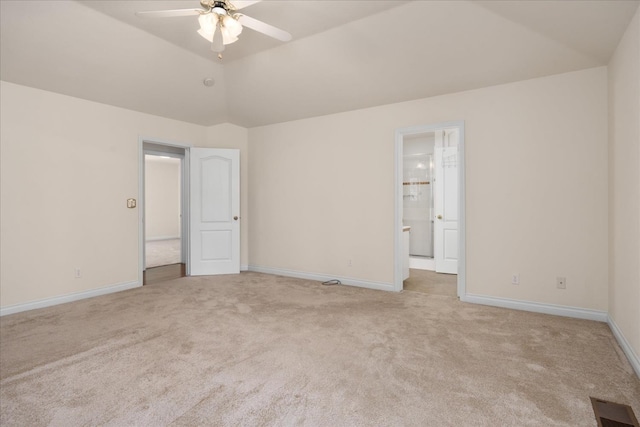 46055 Sutton Dr, Oakhurst, CA 93644 - unfurnished bedroom with light carpet, baseboards, ensuite bath, and lofted ceiling