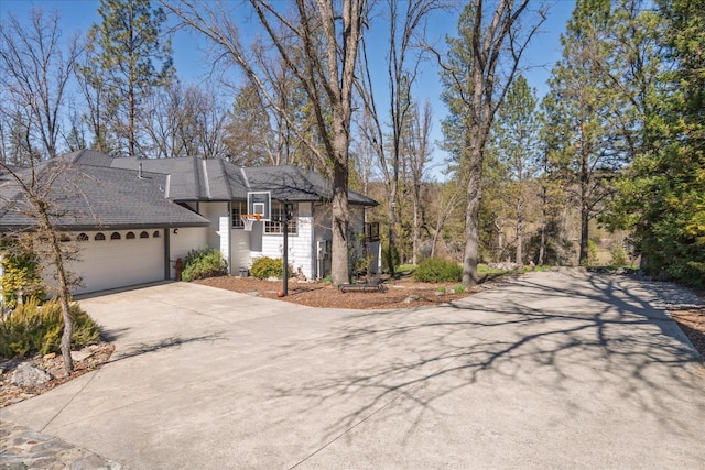 view of front facade with an attached garage and concrete driveway