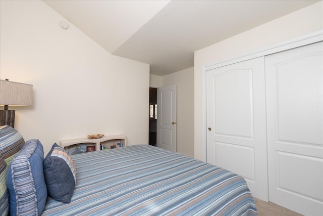 carpeted bedroom featuring a closet