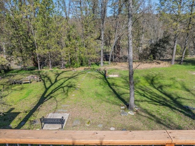 view of yard featuring a forest view