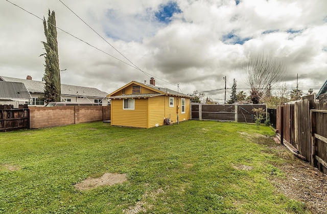 view of yard featuring a gate and a fenced backyard