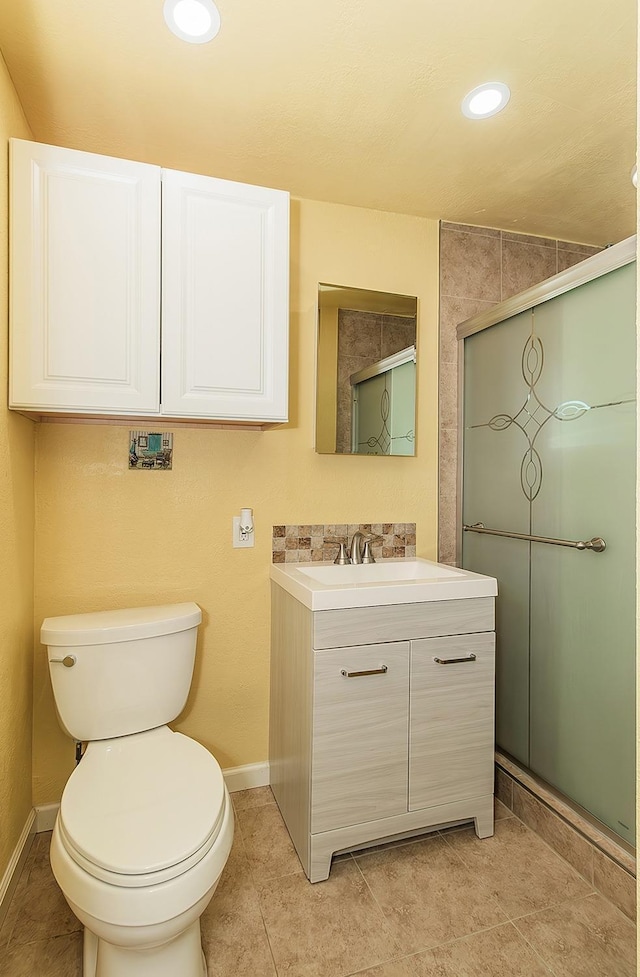 full bathroom with tile patterned flooring, toilet, recessed lighting, a stall shower, and vanity