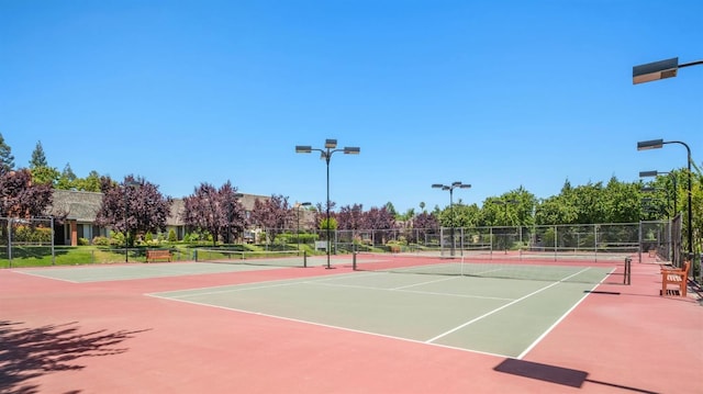 view of sport court with community basketball court and fence