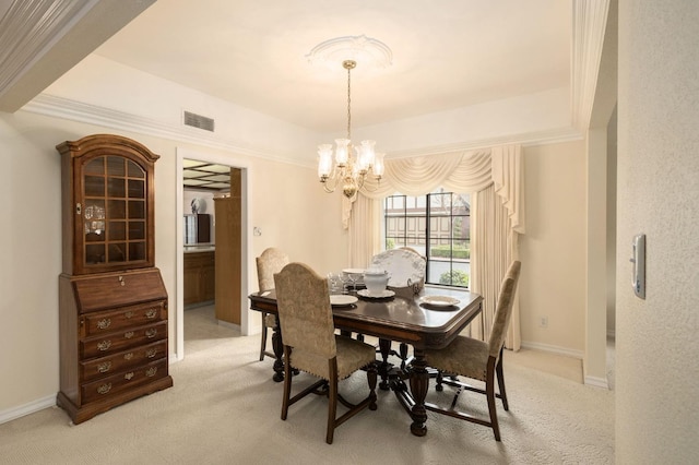 dining area with visible vents, baseboards, a tray ceiling, light carpet, and an inviting chandelier