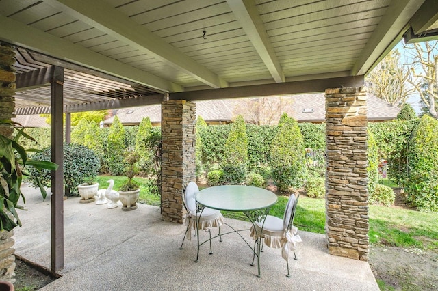 view of patio with outdoor dining space and a pergola