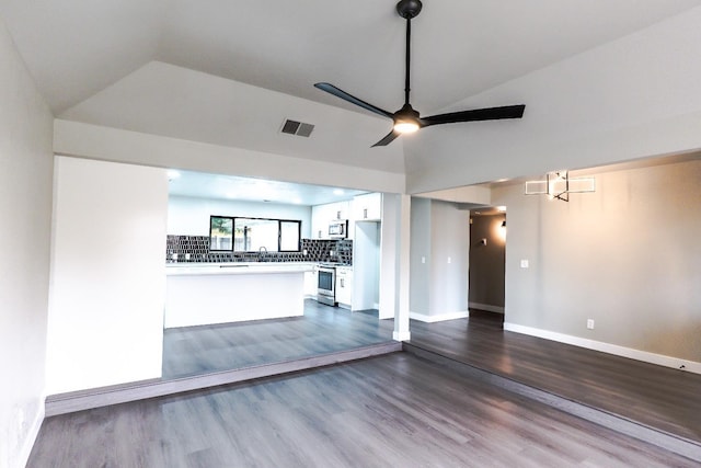 unfurnished living room with visible vents, dark wood-style floors, baseboards, ceiling fan, and vaulted ceiling